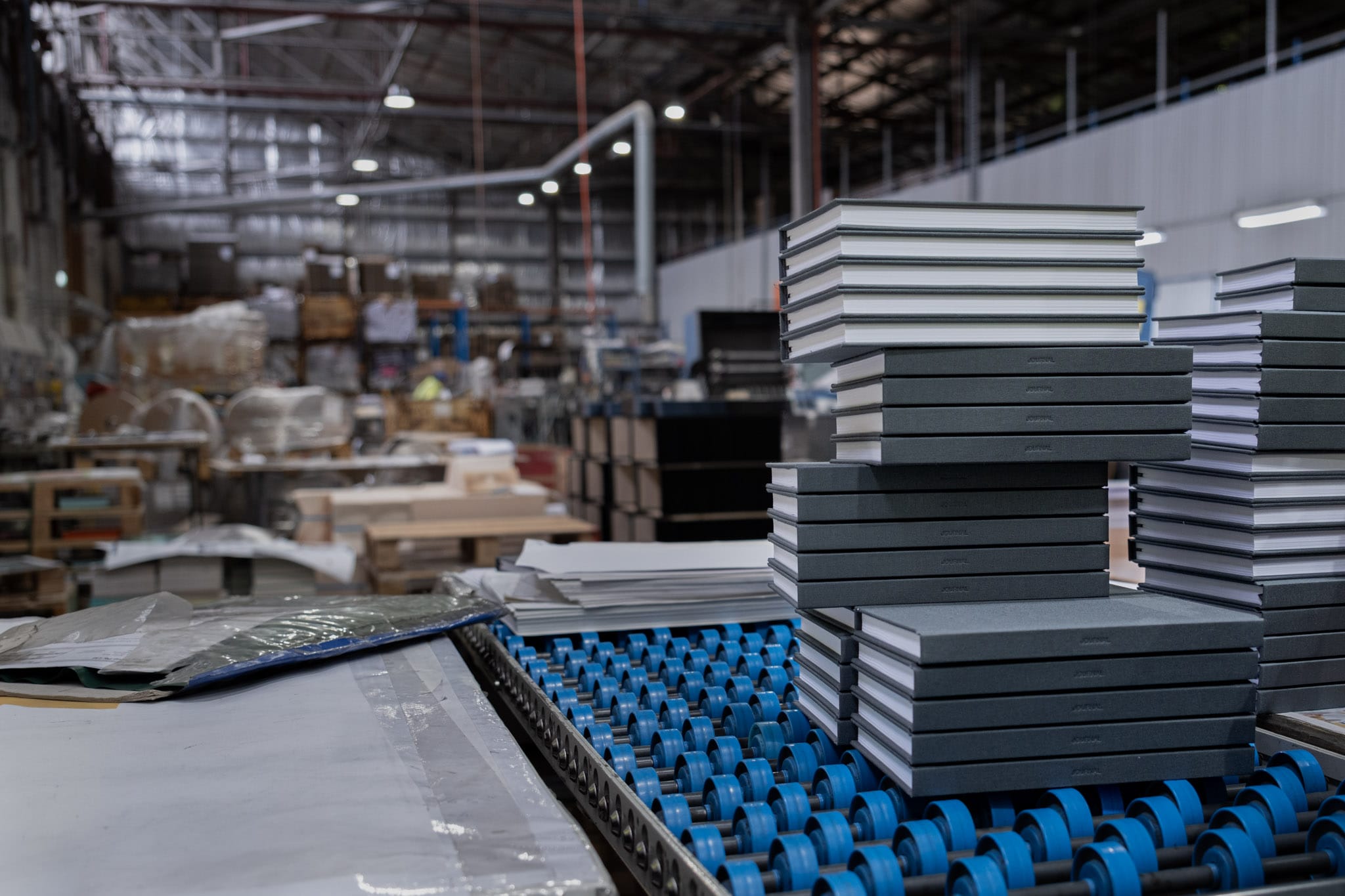 Finished Slate be still journals stacked on the line at Marvel Bookbinding in Melbourne