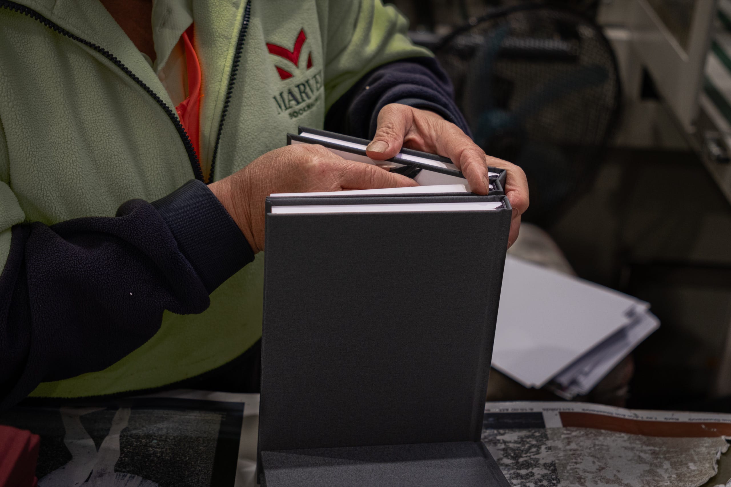 Home A Marvel bookbinder holding a finished be still journal, made in Melbourne