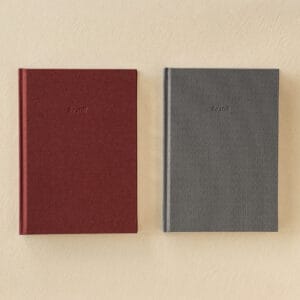 The be still A5 journal in both colourways, Slate grey and Bark burgundy, side by side