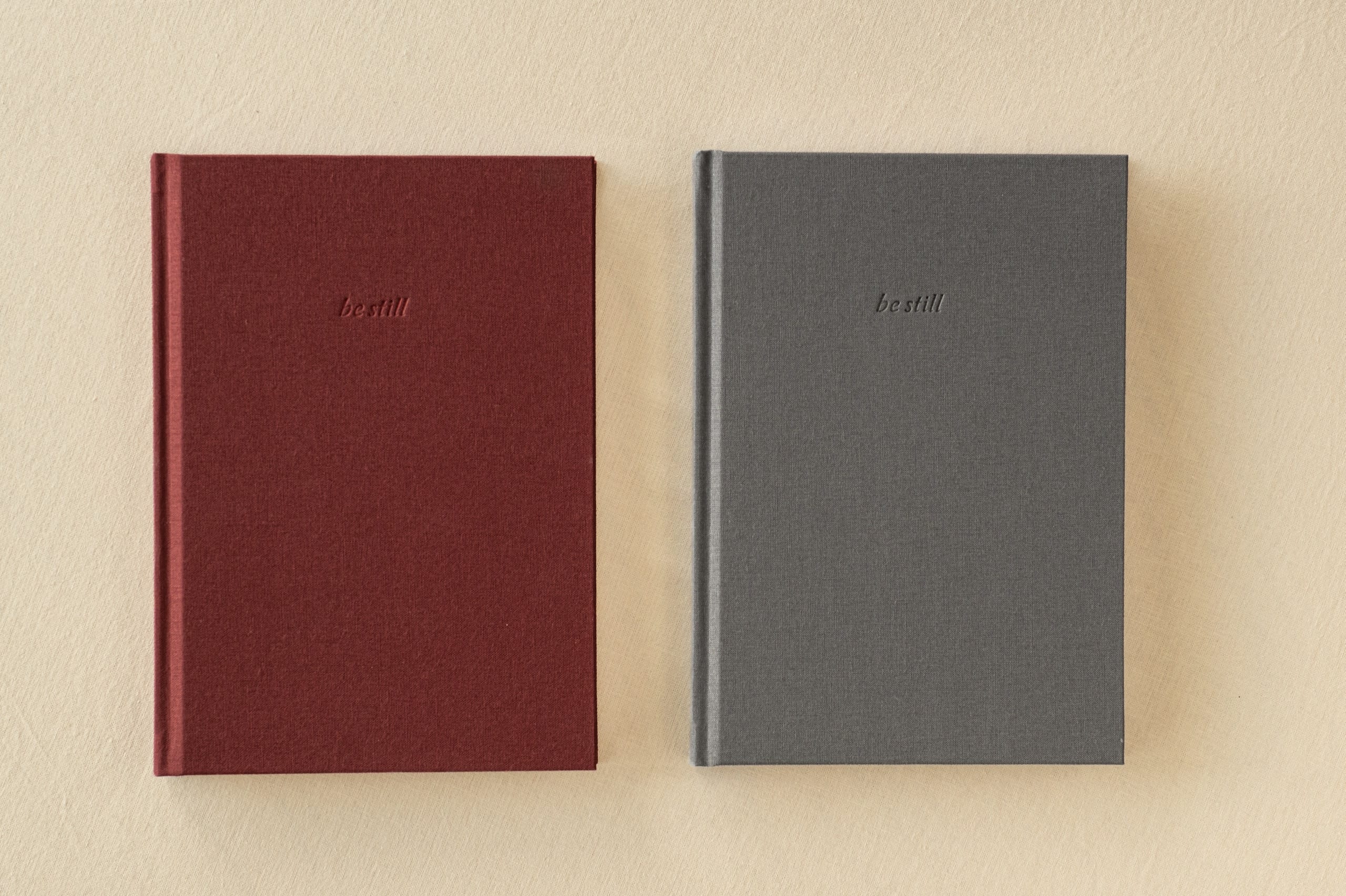 About The be still A5 journal in both colourways, Slate grey and Bark burgundy, side by side