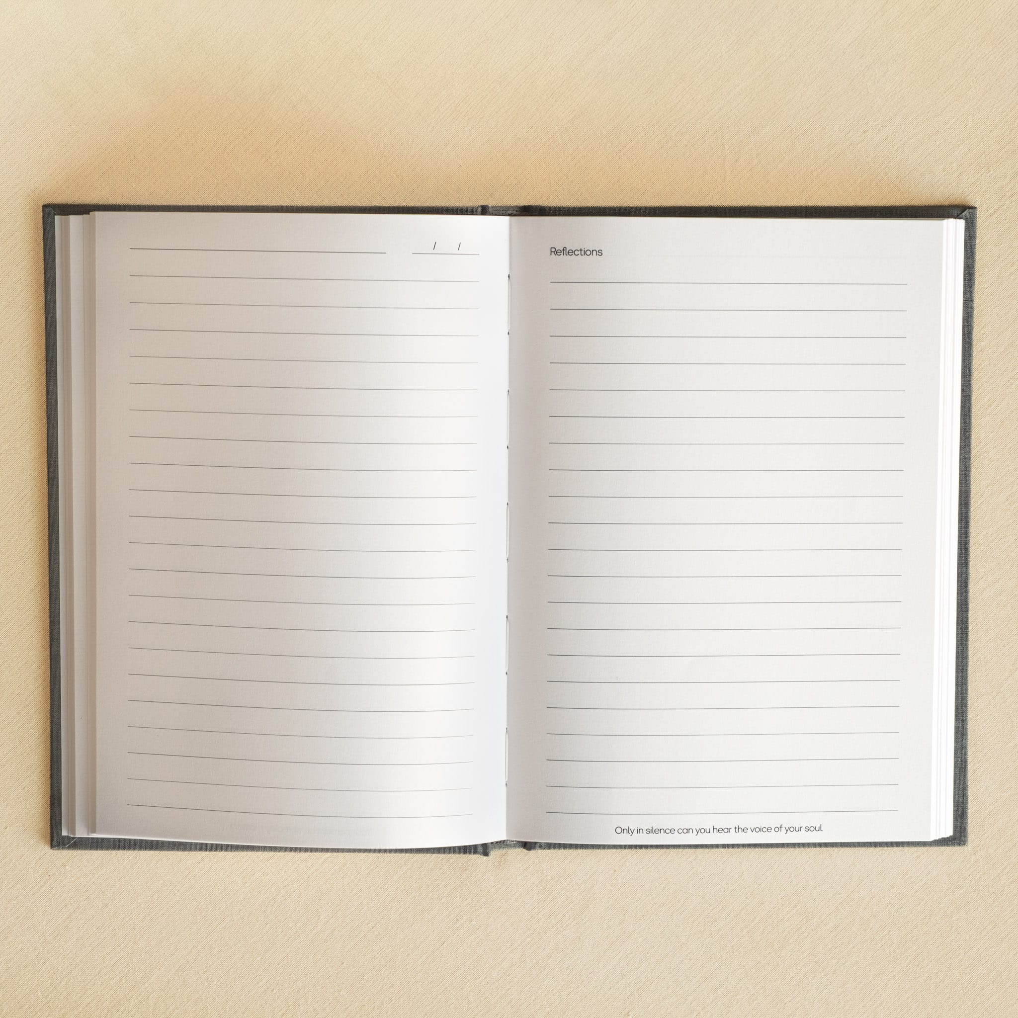 Home The Slate be still A5 journal open flat to a blank ruled spread on warm white paper