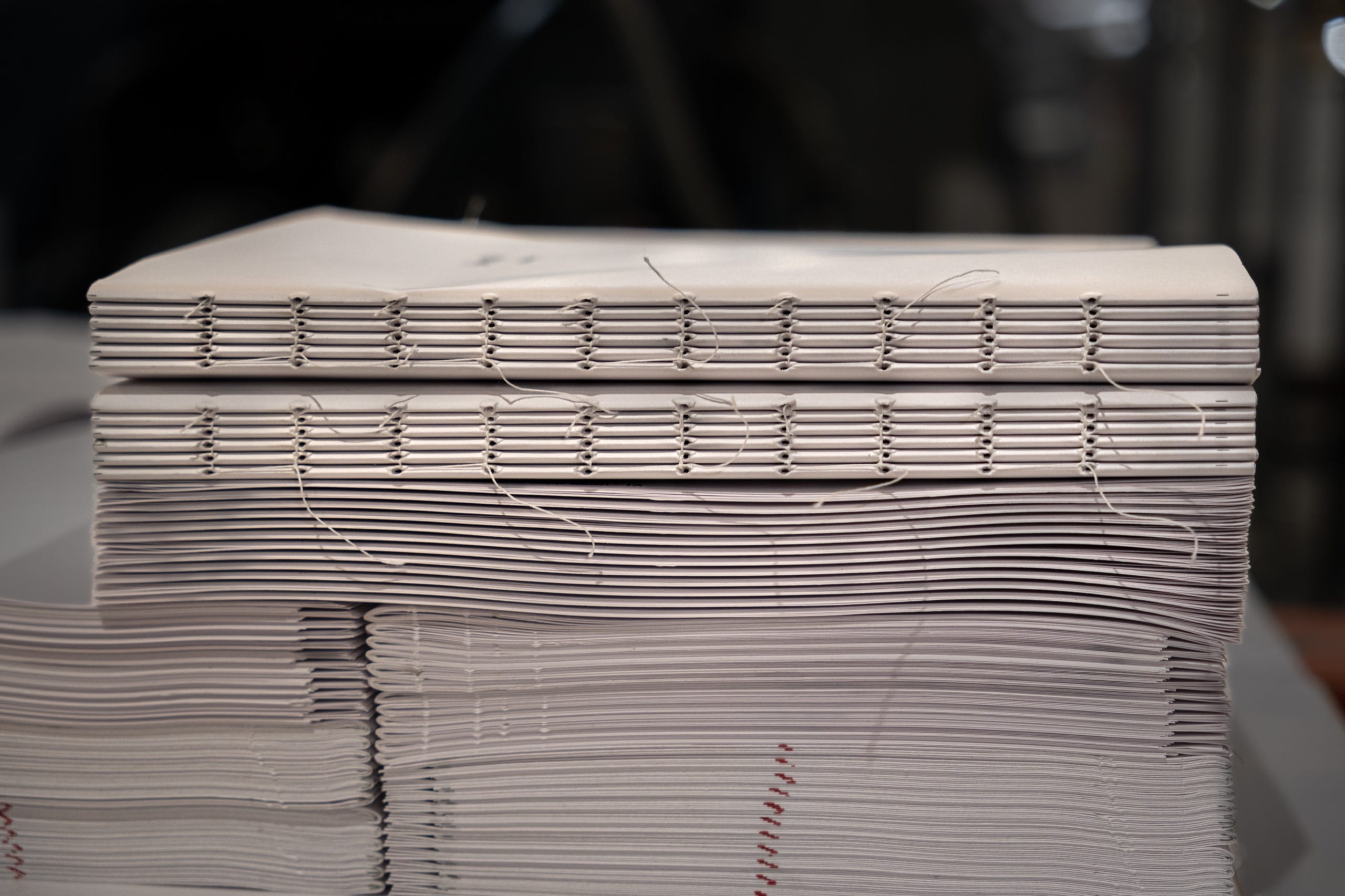 Smyth-sewn be still book blocks showing the exposed binding thread at Marvel Bookbinding