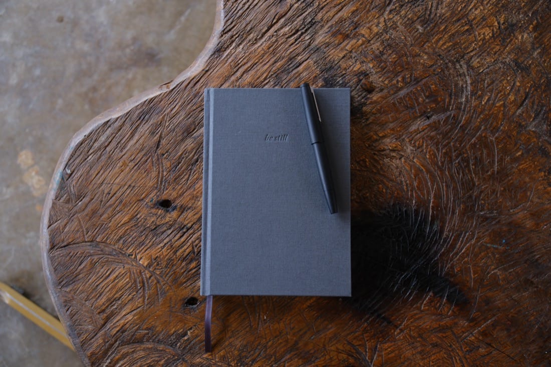 The notebook goes everywhere. The journal never leaves the room.