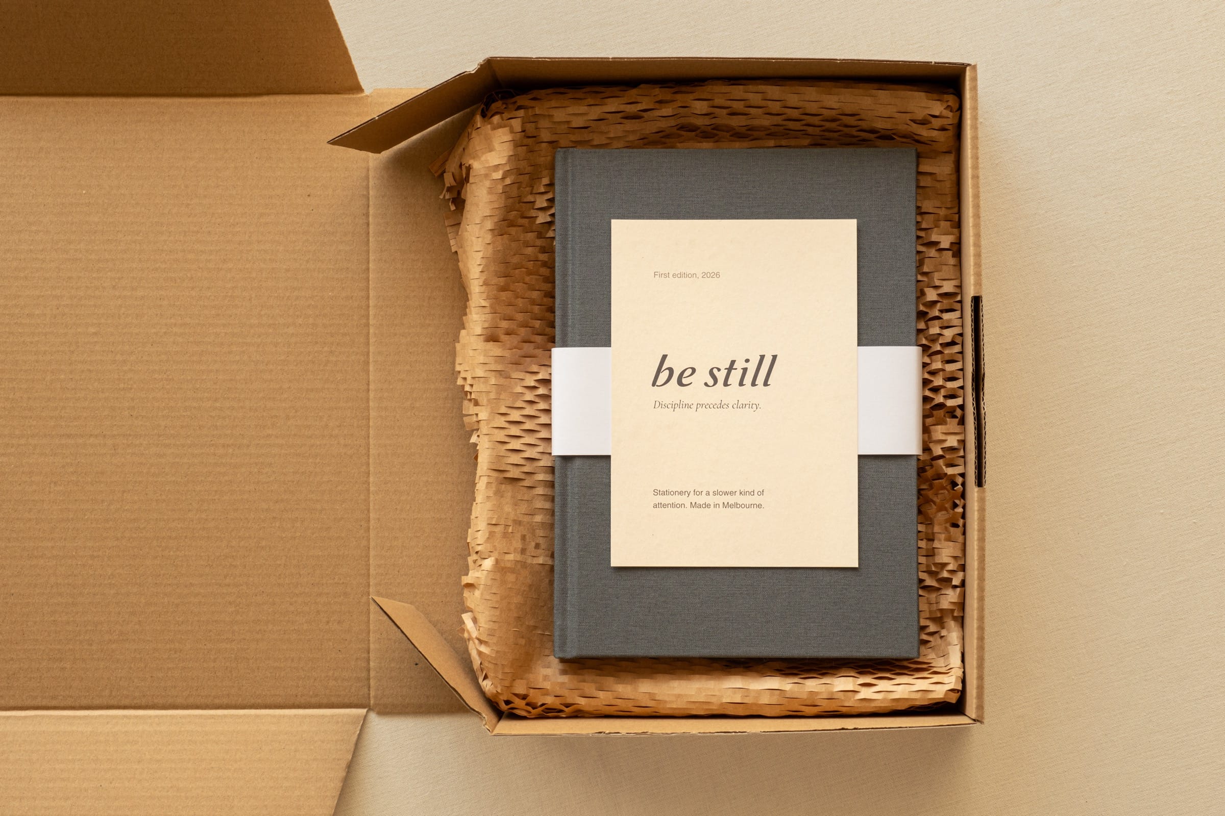Top-down view of the be still journal packed with the quote card alongside